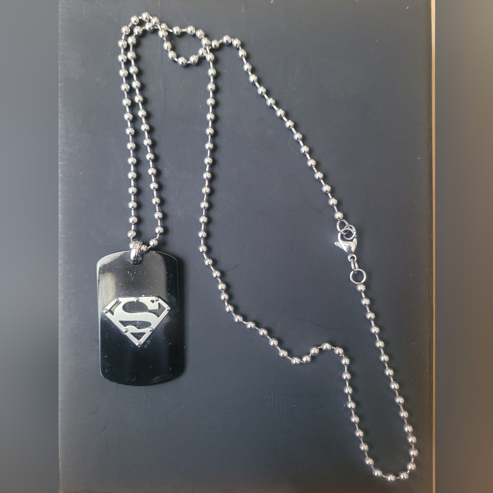 Men's Classic Stainless Steel Superman Dog Tag. The Chain is 22" In Length.